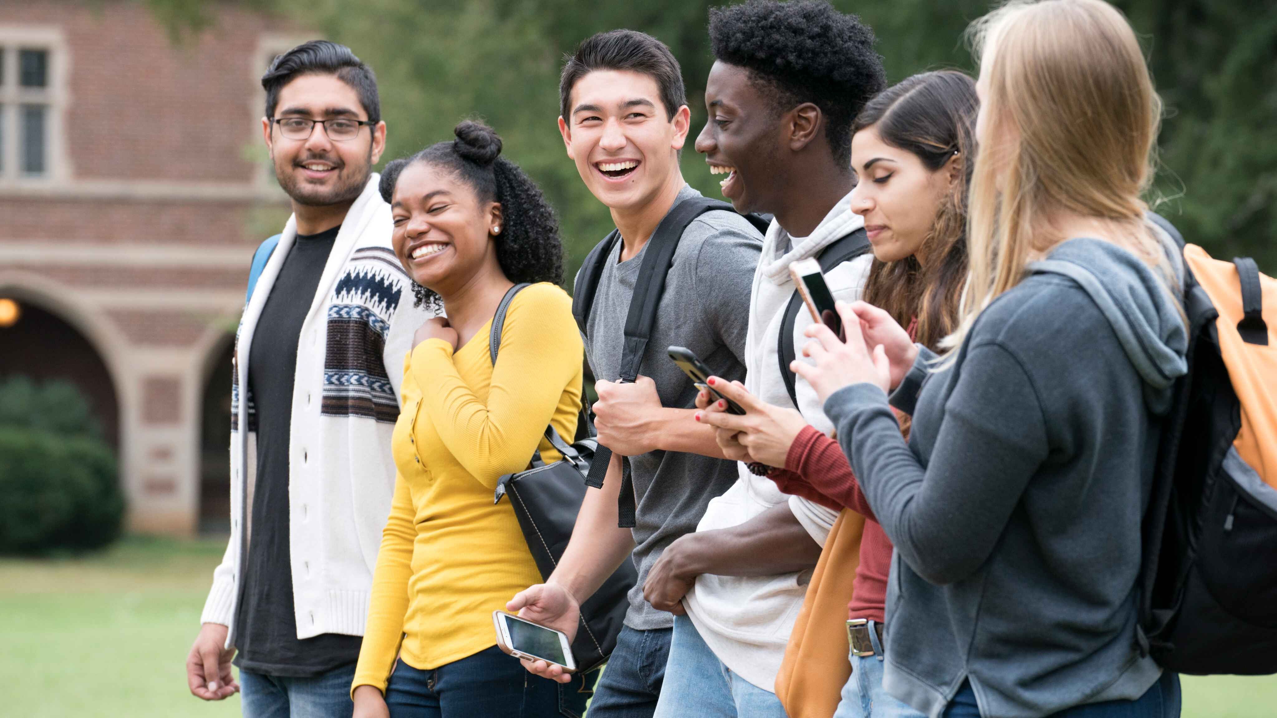 A group of students are laughing together